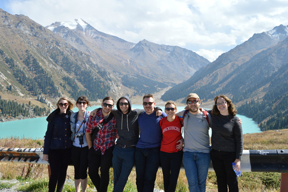 Students in front of a mountain lake.