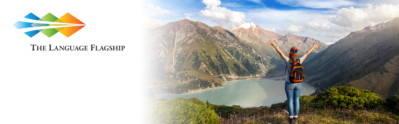 The Language Flagship logo alongside a hiker overlooking a mountain lake.